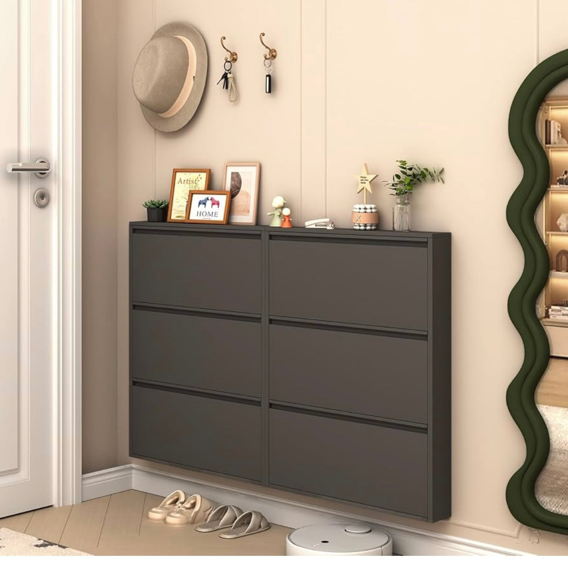 Two black three-drawer shoe cabinets mounted side by side in an entryway