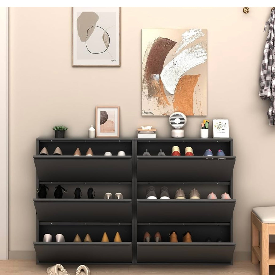 Two black shoe cabinets with six open flip-down compartments displaying organized footwear.