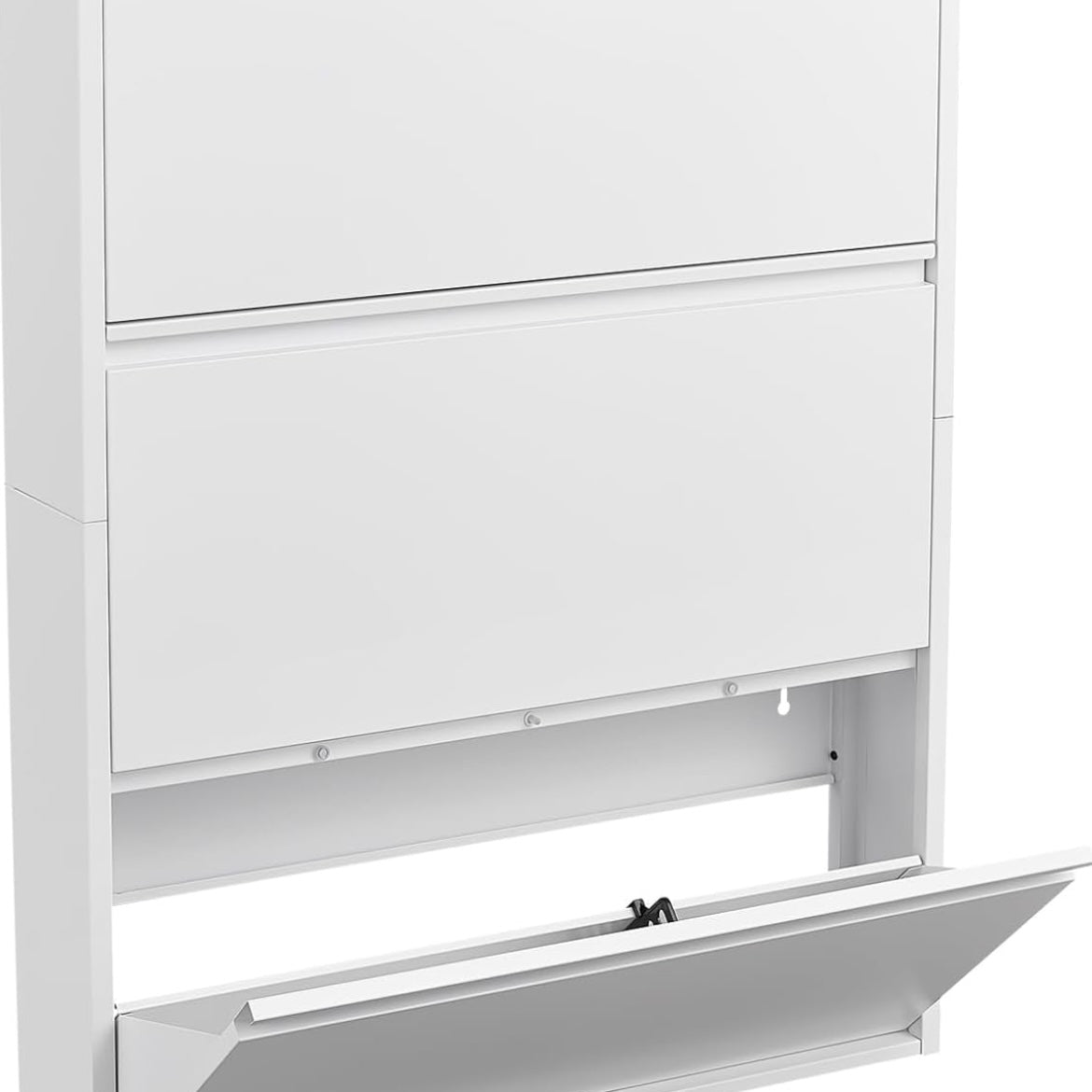 Close-up of an open flip-down drawer on a white metal shoe storage cabinet.